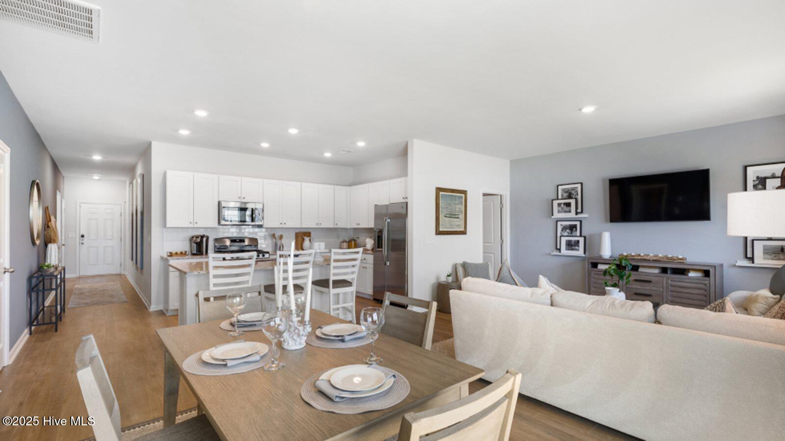 226 Ladyfish Loop Northwest, Unit LOT 1 DOVER Sunset Beach, NC 28468 - Photo 9 of 14 8 dining, family room and kitchen