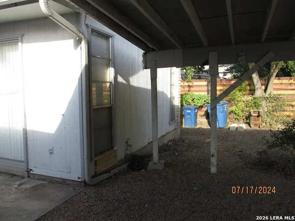 a view of a room with sliding door and wooden floor