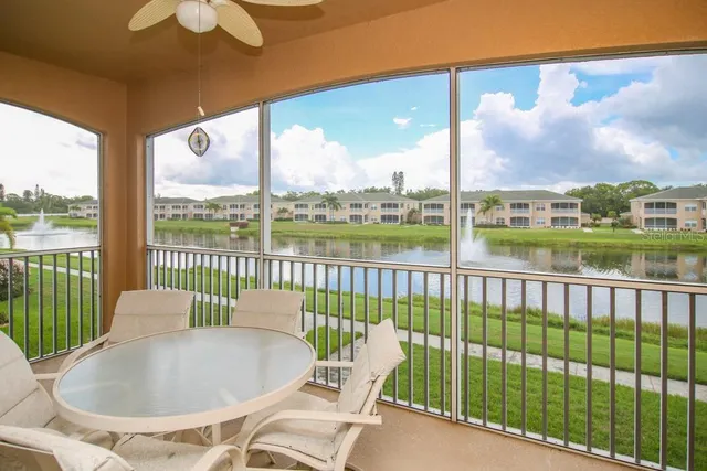 a view of a chairs and table in the balcony