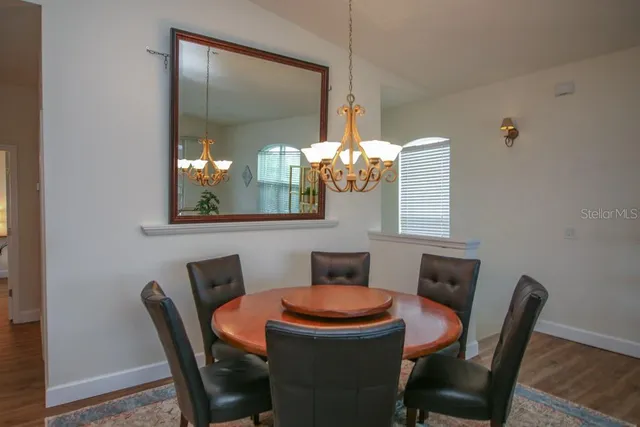 a dining room with furniture and window