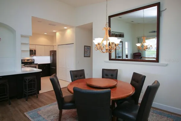 a dining room with furniture and window