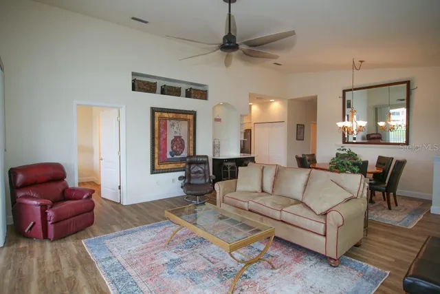 a living room with furniture rug and window