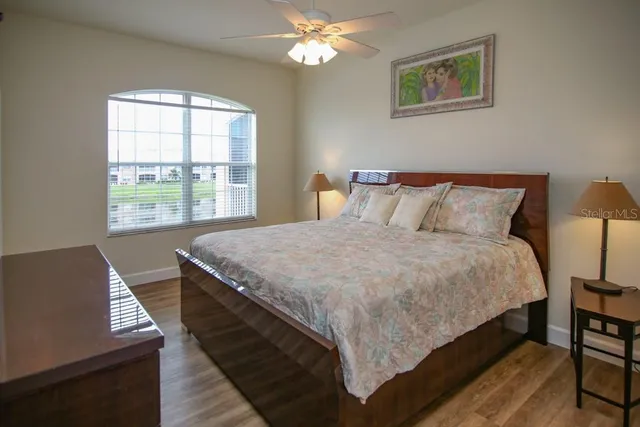 a bed sitting in a bedroom next to a window