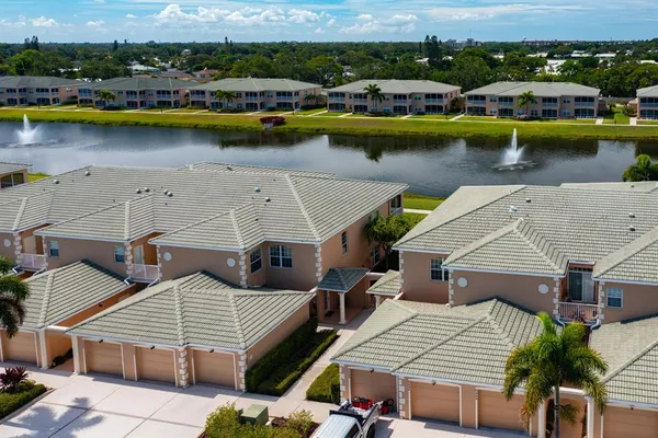 an aerial view of a house with a lake view