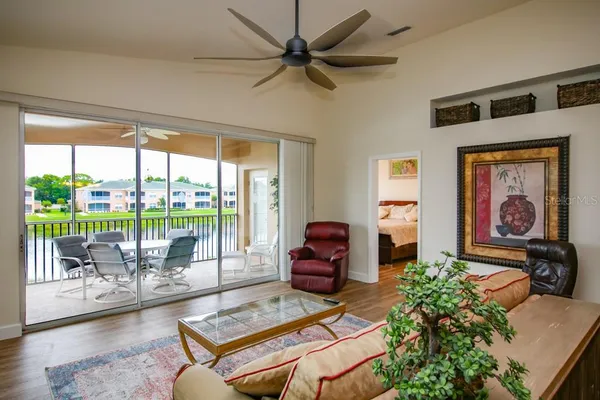 a living room with furniture and a large window