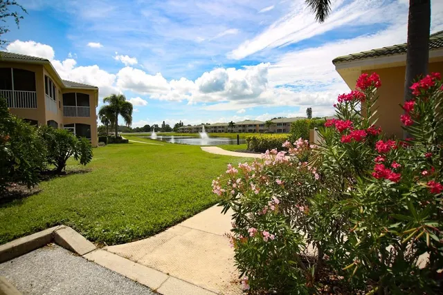a view of a lake with a house in the background