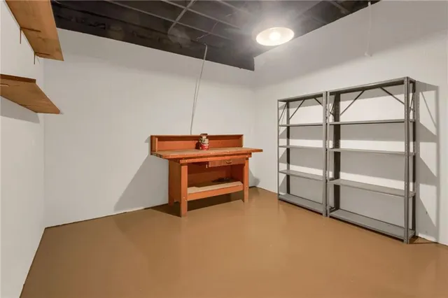 a room with walk in closet and window