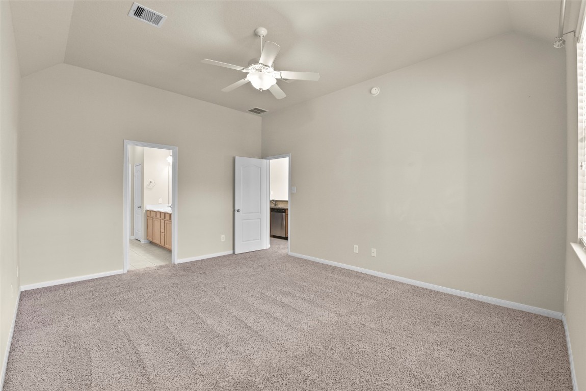 39 Butternut Grove Place Tomball, TX 77375 - Photo 13 of 29 a view of an empty room with a chandelier fan