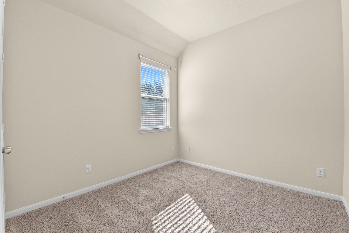 39 Butternut Grove Place Tomball, TX 77375 - Photo 21 of 29 a view of an empty room with a window