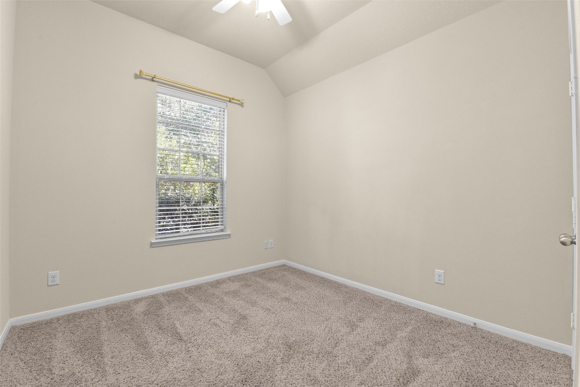 39 Butternut Grove Place Tomball, TX 77375 - Photo 22 of 29 an empty room with a window