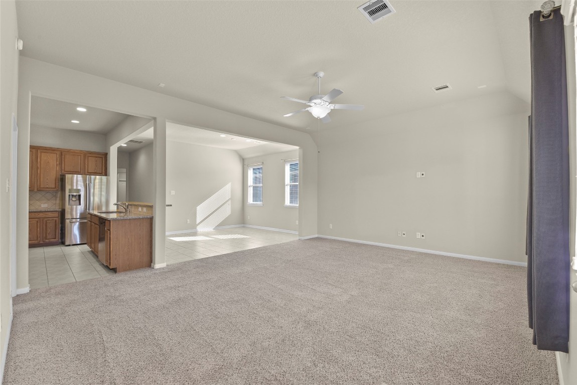 39 Butternut Grove Place Tomball, TX 77375 - Photo 8 of 29 a view of a kitchen with a refrigerator and a sink