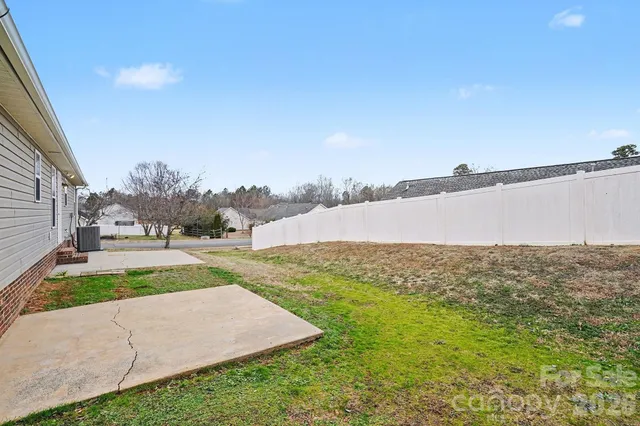 a view of a field with an ocean