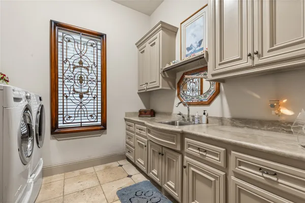 a kitchen with stainless steel appliances granite countertop a stove microwave and refrigerator
