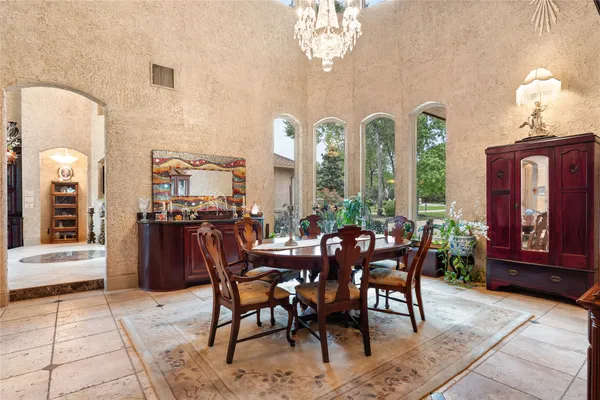 a view of a dining room with furniture window and outside view
