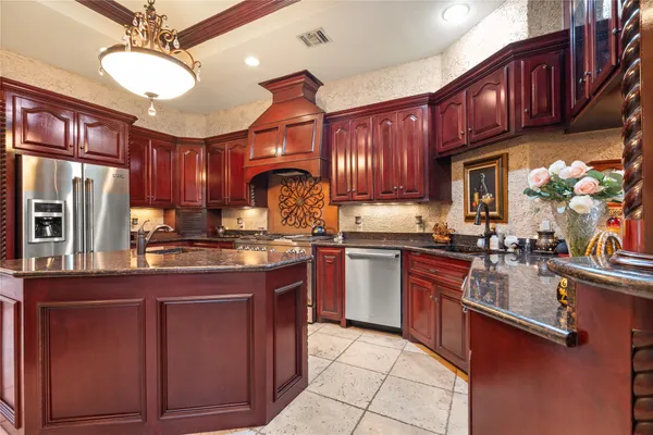 a spacious bathroom with a granite countertop sink and a mirror