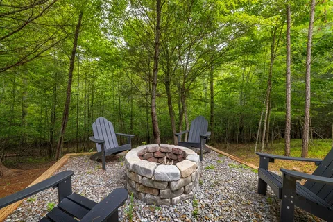 a view of a chair and tables in the balcony