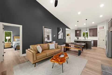 a living room with furniture and a table