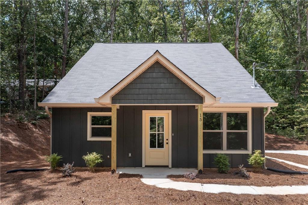 15 Weaver Street Buchanan, GA 30113 - Photo 2 of 22 a front view of a house with a yard and garage