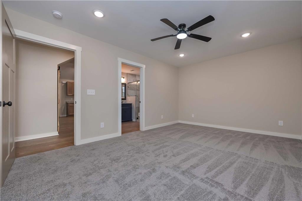 15 Weaver Street Buchanan, GA 30113 - Photo 21 of 22 an empty room with closet and ceiling fan