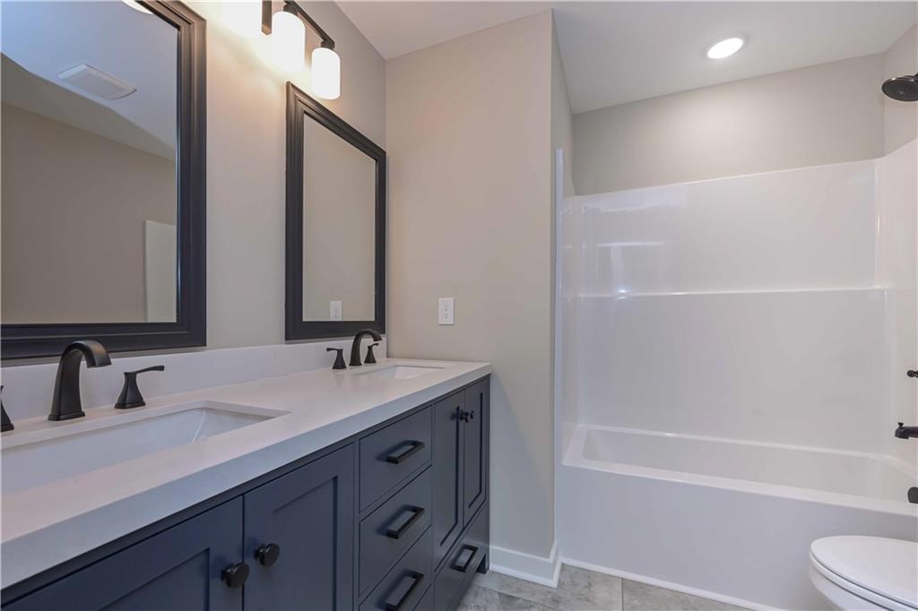 15 Weaver Street Buchanan, GA 30113 - Photo 22 of 22 a bathroom with a sink a toilet and shower