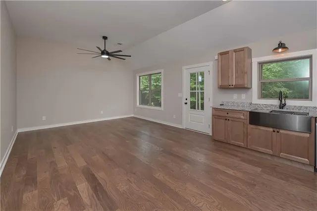 a kitchen with a sink cabinets and window
