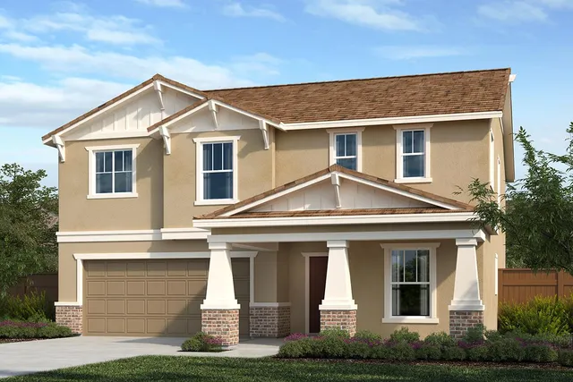 a front view of a house with garage