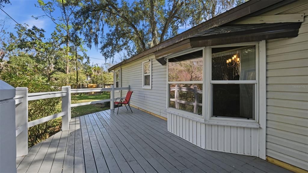 10565 Bessemer Street New Port Richey, FL 34654 - Photo 43 of 72 a view of deck with a large window and wooden floor