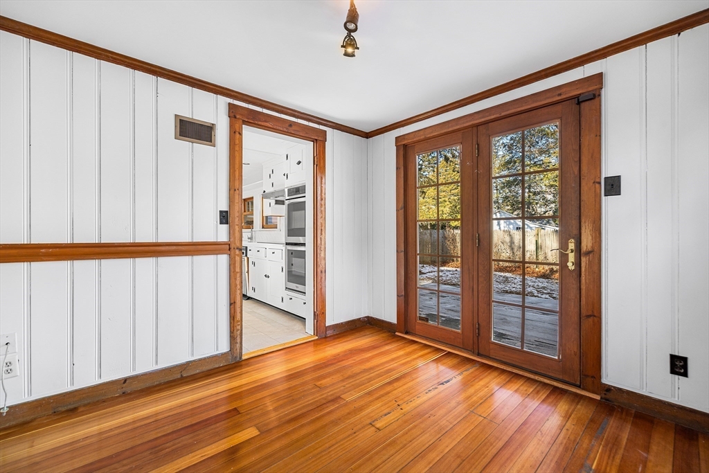 337 Edgell Road Framingham, MA 01701 - Photo 11 of 36 a view of an empty room with wooden floor and a window