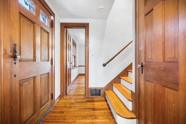 a view of room with window and wooden floor