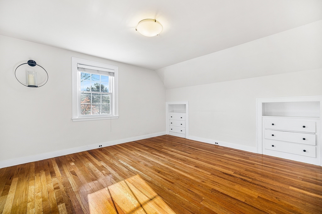 337 Edgell Road Framingham, MA 01701 - Photo 24 of 36 a view of room with window and wooden floor