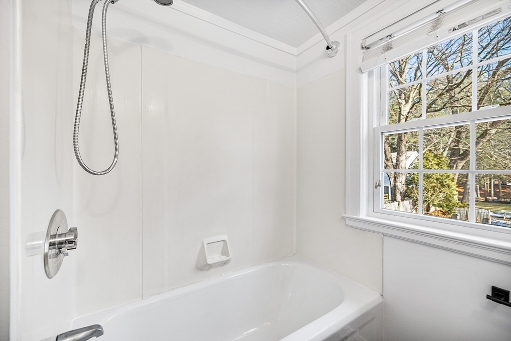 337 Edgell Road Framingham, MA 01701 - Photo 28 of 36 a bathroom with a bath tub with a shower