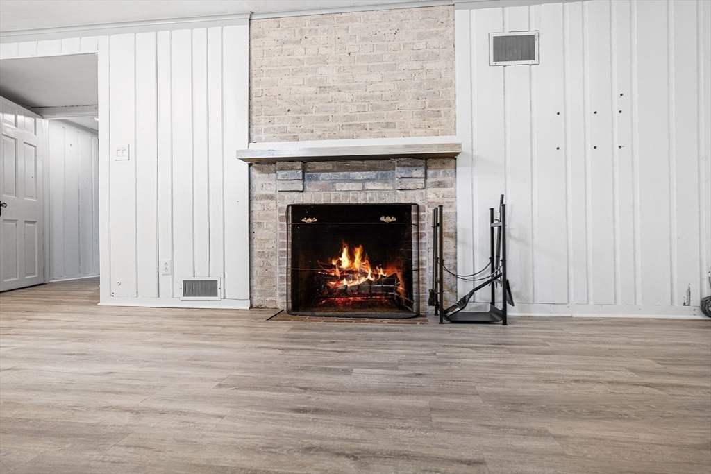 337 Edgell Road Framingham, MA 01701 - Photo 33 of 36 a living room with a fireplace