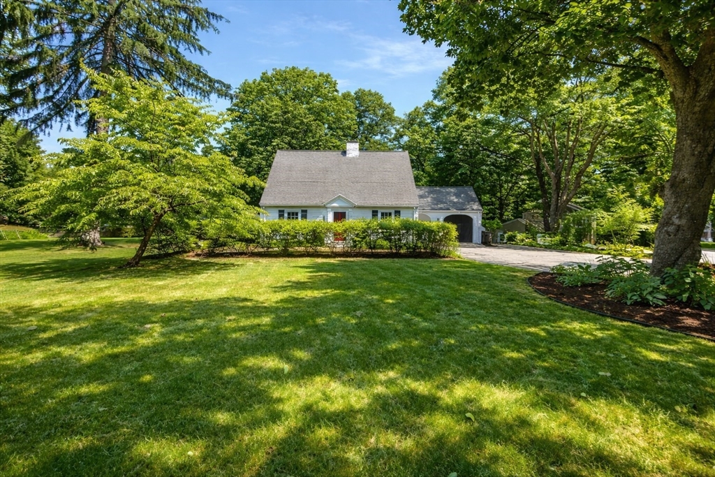 337 Edgell Road Framingham, MA 01701 - Photo 35 of 36 a view of an house with backyard space and garden