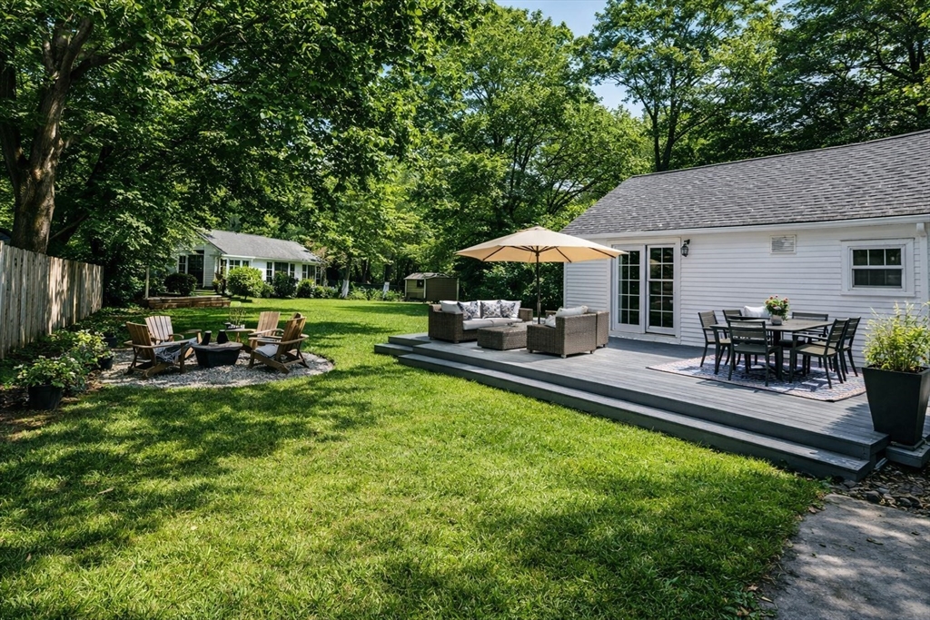 337 Edgell Road Framingham, MA 01701 - Photo 4 of 36 a view of a house with backyard porch and sitting area