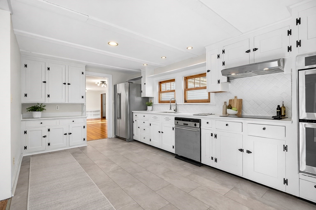 337 Edgell Road Framingham, MA 01701 - Photo 7 of 36 a large white room with cabinets