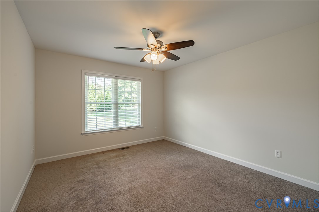 6720 Claiborne Road Sutherland, VA 23885 - Photo 26 of 35 Neutral tone wall color, window with blinds, ceili
