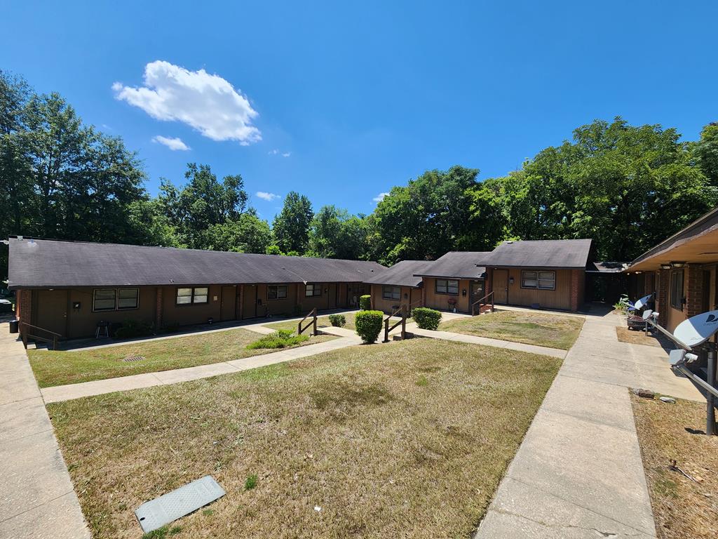 a view of a swimming pool with a patio