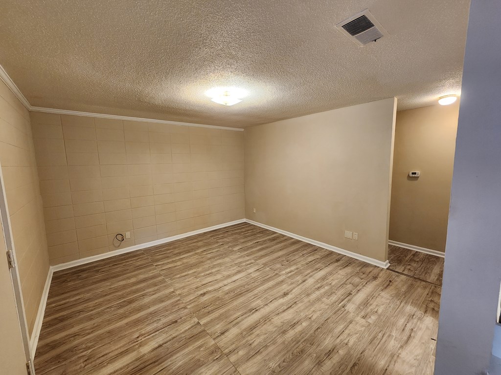 3981 Holly Avenue, Unit 8 Columbus, GA 31904 - Photo 7 of 8 a view of room with wooden floor and fan