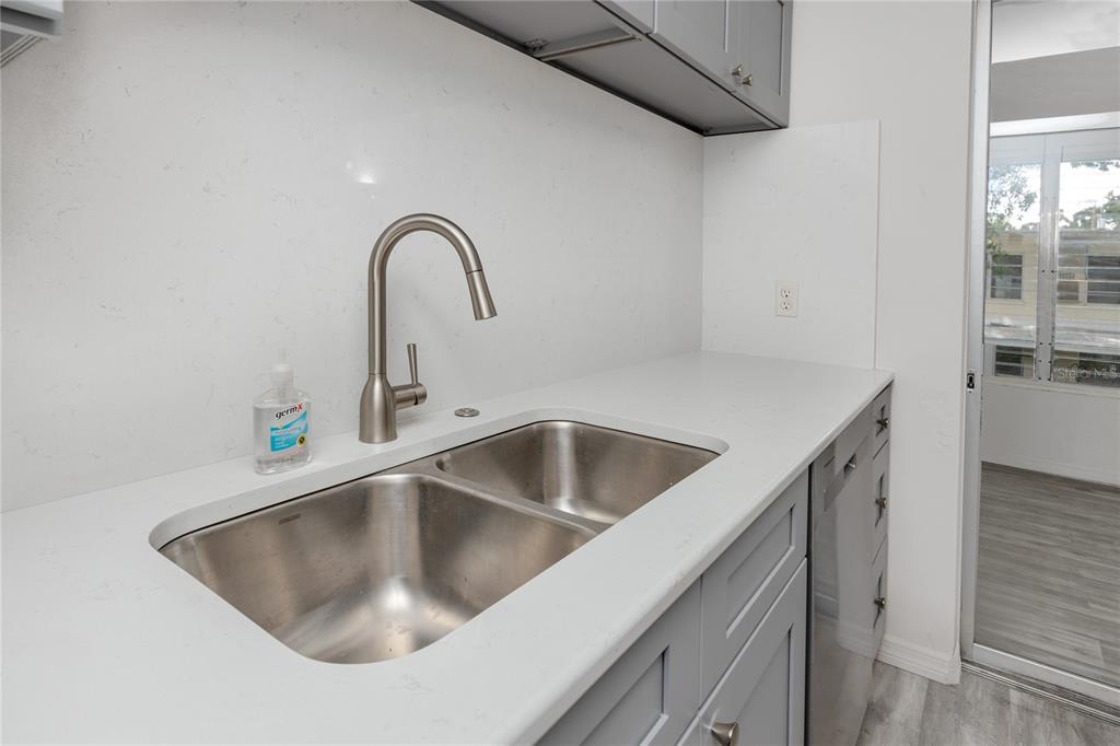4152 55th Way North, Unit 1028 Kenneth City, FL 33709 - Photo 18 of 46 a close view of a sink and tap