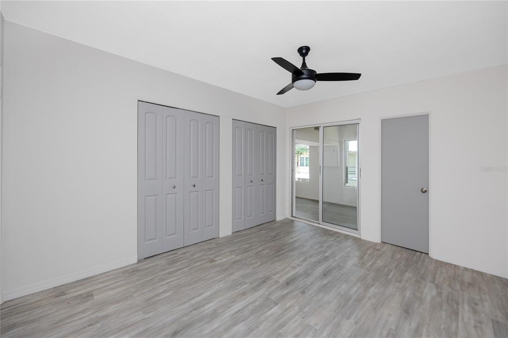 4152 55th Way North, Unit 1028 Kenneth City, FL 33709 - Photo 28 of 46 a view of empty room with wooden floor