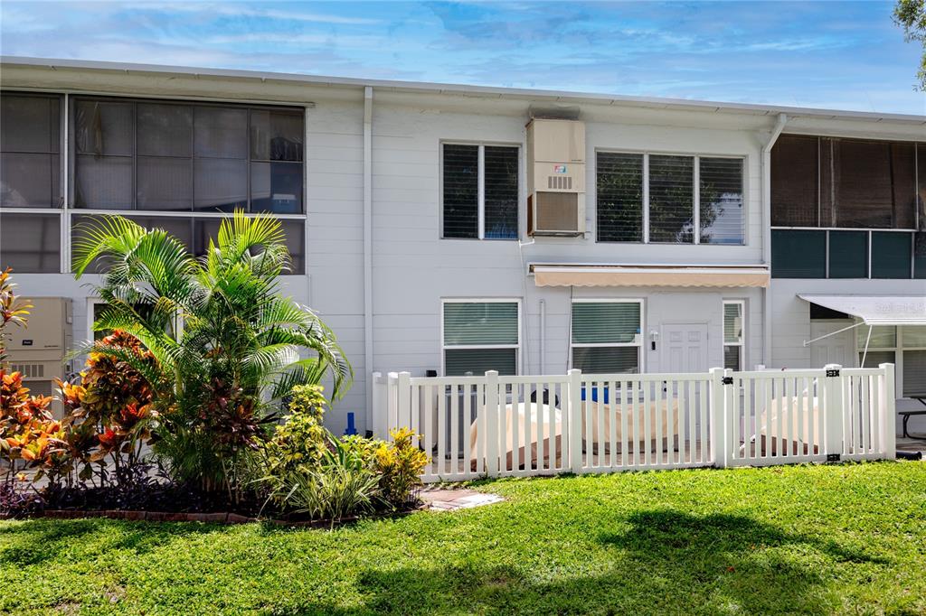 4152 55th Way North, Unit 1028 Kenneth City, FL 33709 - Photo 39 of 46 a garden view