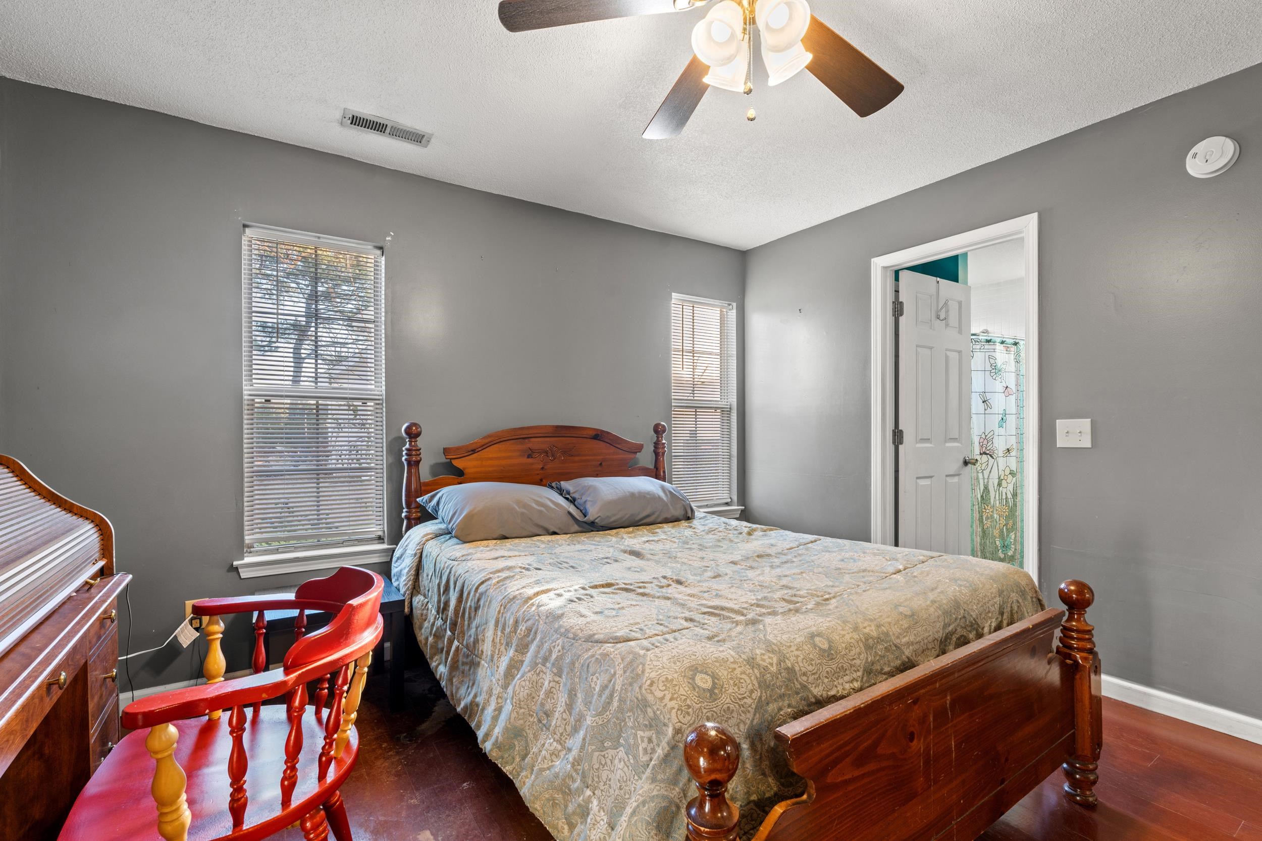 539 Drake Lane Surfside Beach, SC 29575 - Photo 13 of 38 Bedroom featuring a textured ceiling, ceiling fan, and dark wood finished floors