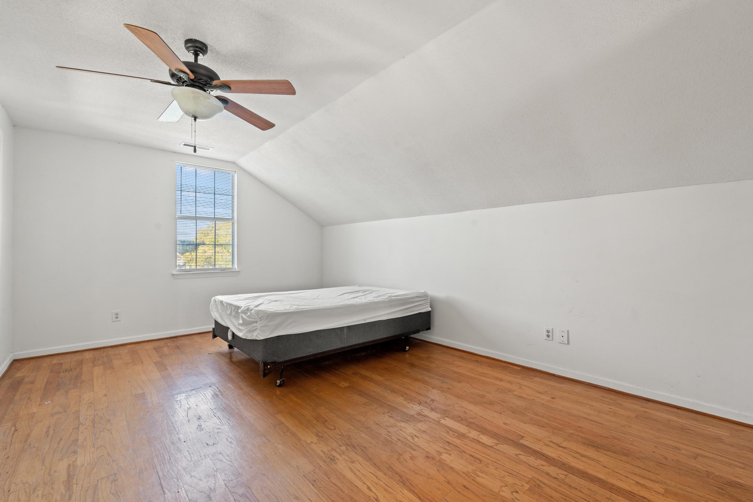 539 Drake Lane Surfside Beach, SC 29575 - Photo 21 of 38 Bedroom featuring a ceiling fan, light wood-style flooring, and lofted ceiling