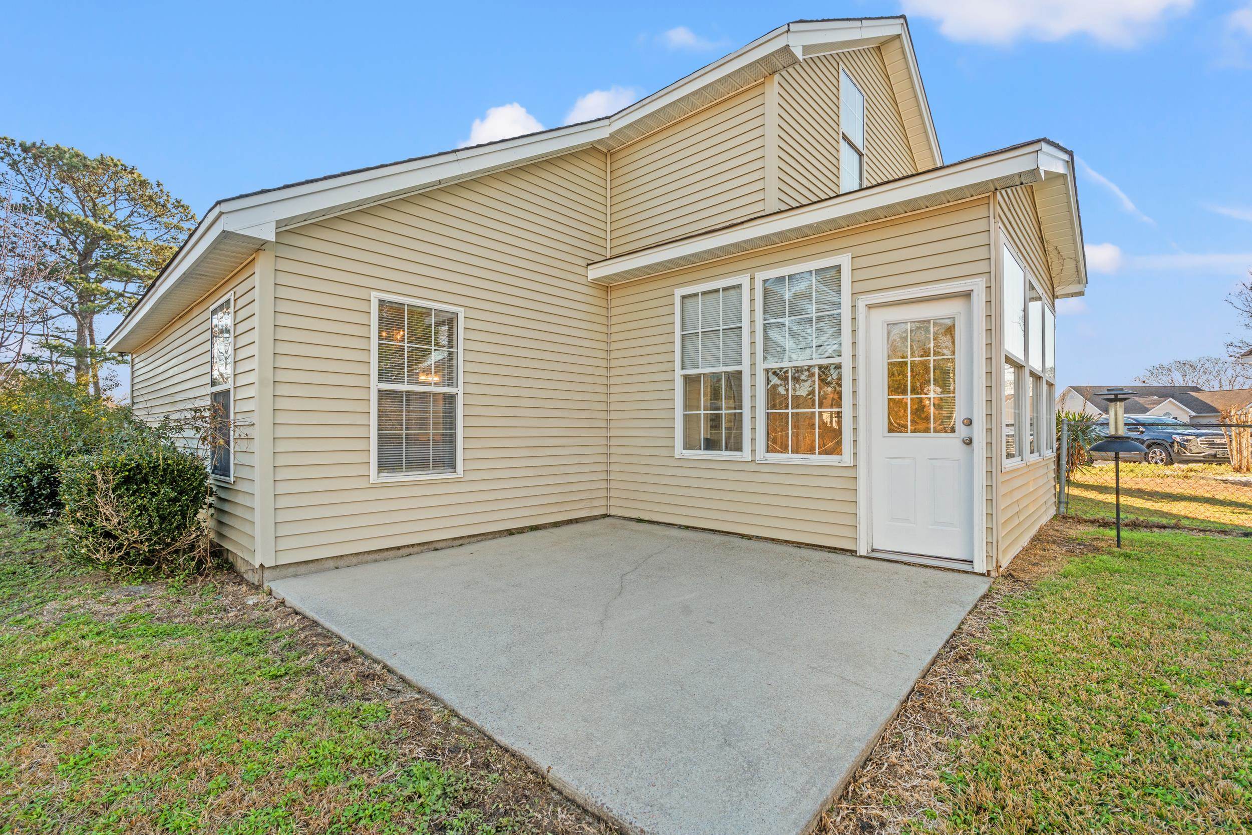 539 Drake Lane Surfside Beach, SC 29575 - Photo 24 of 38 Rear view of property with a patio area and a yard