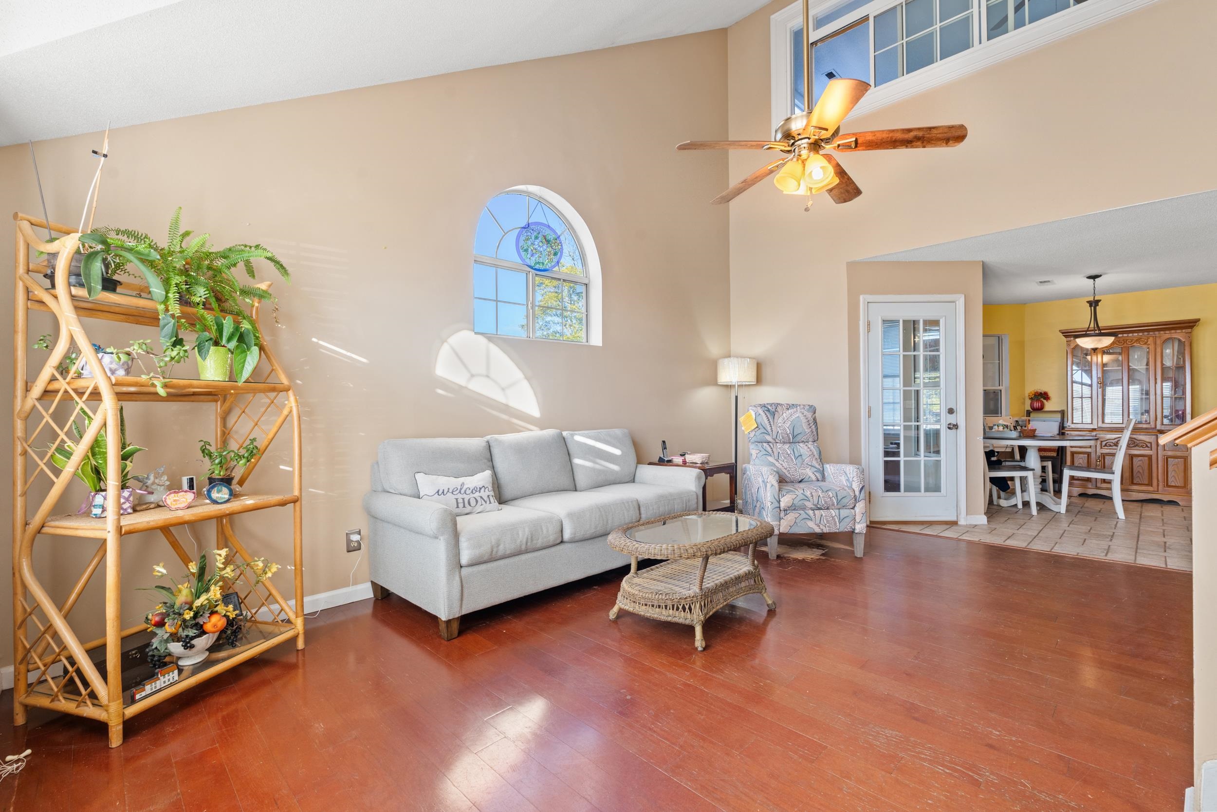 539 Drake Lane Surfside Beach, SC 29575 - Photo 4 of 38 Living area featuring ceiling fan, wood finished floors, and high vaulted ceiling
