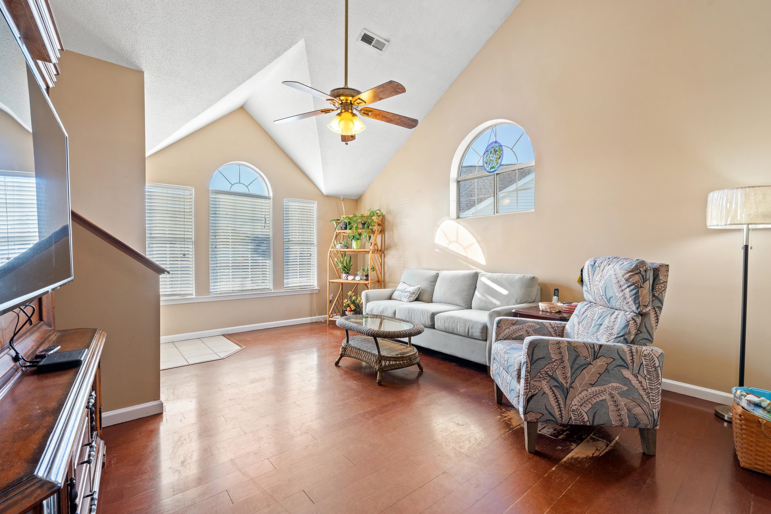 539 Drake Lane Surfside Beach, SC 29575 - Photo 6 of 38 Living area with ceiling fan, plenty of natural light, dark wood-type flooring, and high vaulted ceiling