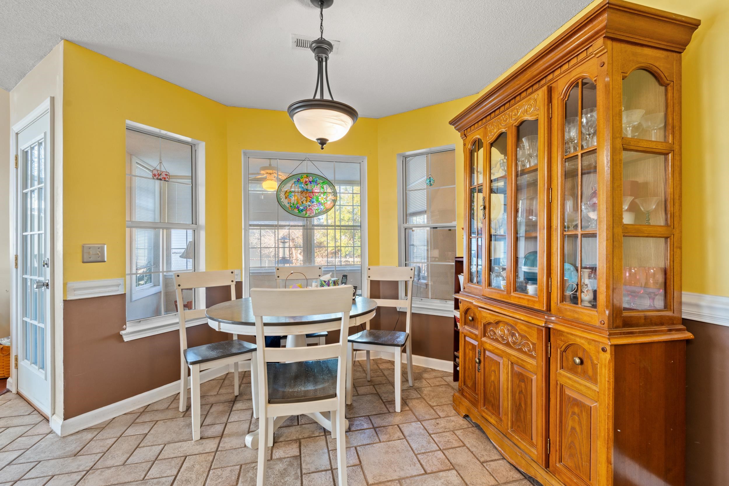 539 Drake Lane Surfside Beach, SC 29575 - Photo 9 of 38 Dining area featuring baseboards and stone tile floors