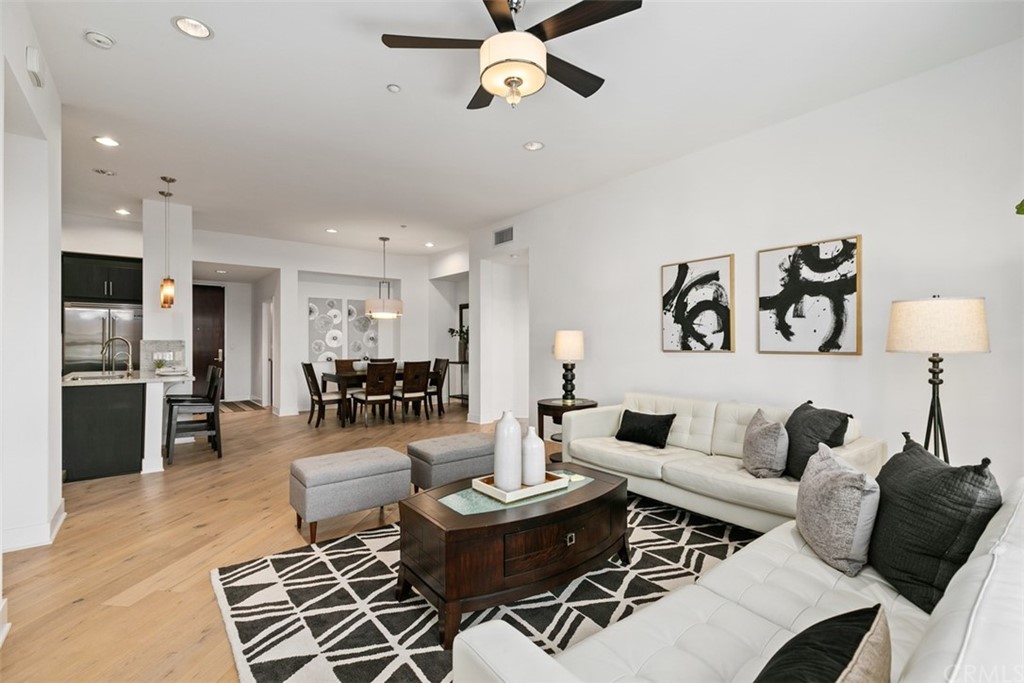 402 Rockefeller, Unit 406 Irvine, CA 92612 - Photo 3 of 35 a living room with furniture and kitchen view