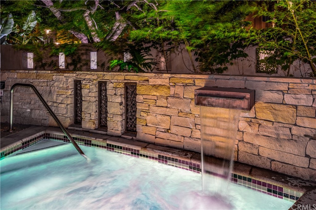 402 Rockefeller, Unit 406 Irvine, CA 92612 - Photo 25 of 35 a view of a backyard with wooden fence