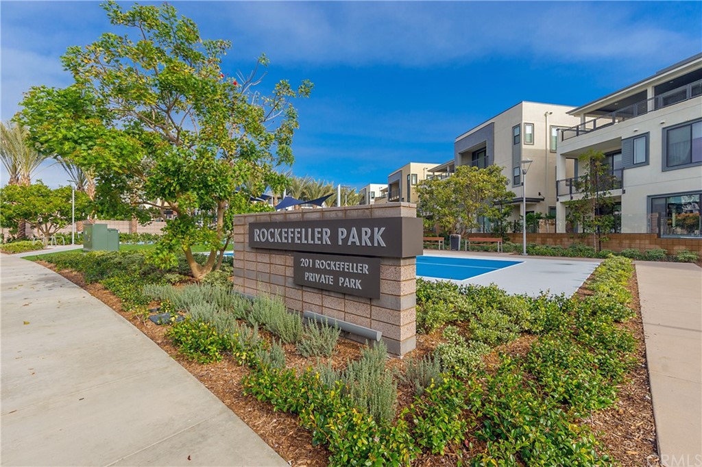 402 Rockefeller, Unit 406 Irvine, CA 92612 - Photo 30 of 35 a view of a sign board with flower garden